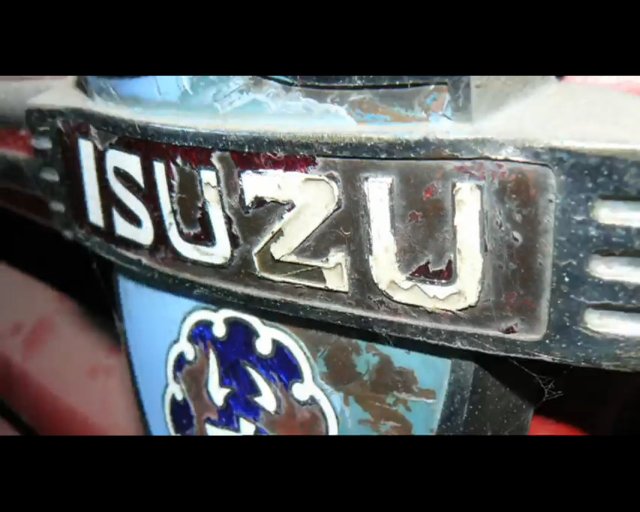2010 Isuzu D-Max advert - 44 - grubby old Isuzu badge.jpg